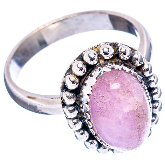 Sterling silver oval gemstone ring with raised beaded prong halo around pink stone