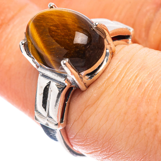 Tiger's eye oval stone sterling silver ring, side view with four-prong bezel