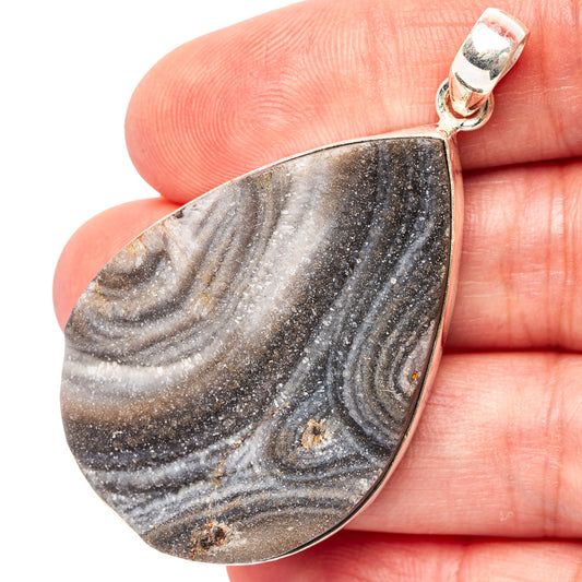 Sterling silver teardrop druzy pendant with dark gray and blue swirled stone