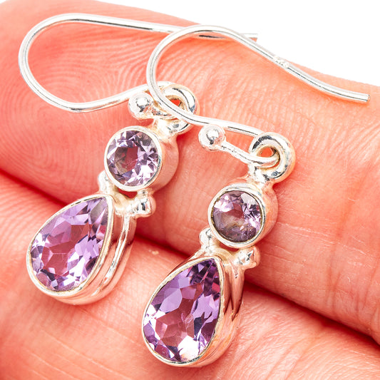 Amethyst teardrop earrings in .925 sterling silver, with two purple faceted drops and hooks