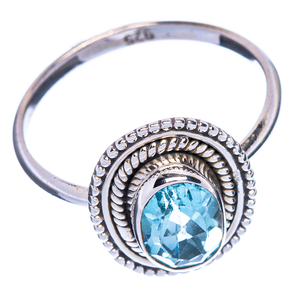 Oval blue topaz sterling silver ring with textured halo and scalloped detail