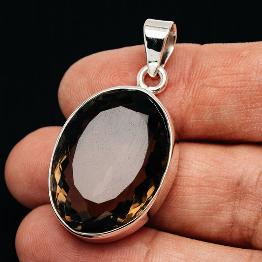 Oval faceted smoky quartz pendant with .925 sterling silver bezel and bail