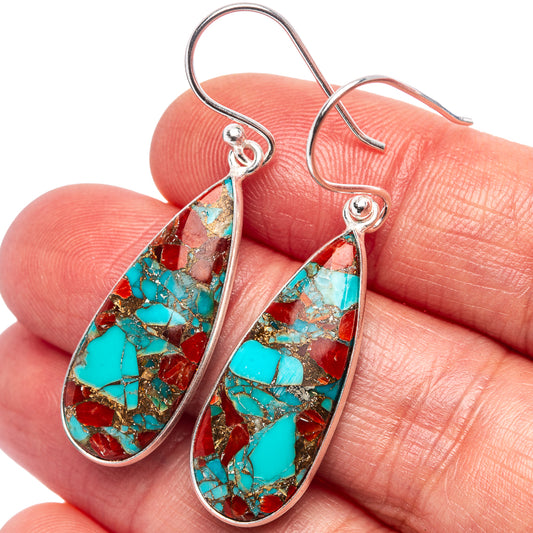 Close-up of turquoise and coral matrix teardrop earrings on sterling silver hooks