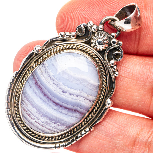 Oval blue lace agate pendant in ornate .925 sterling silver setting
