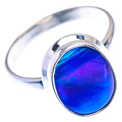 Sterling silver ring with blue oval opal cabochon, arched band and bezel set