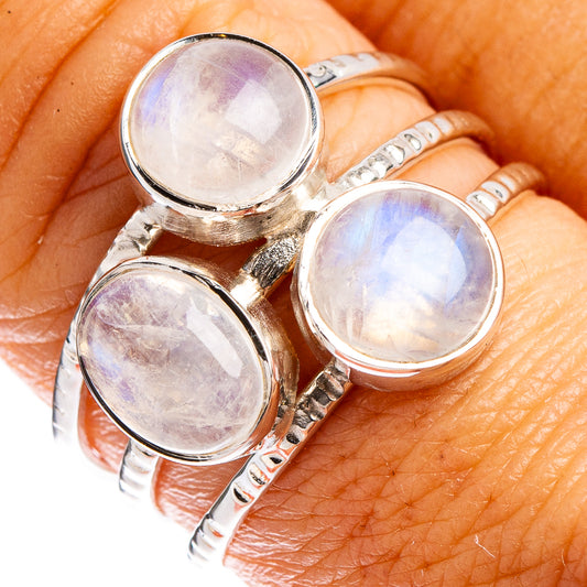 Rainbow moonstone ring on finger, three round moonstone cabochons on sterling silver