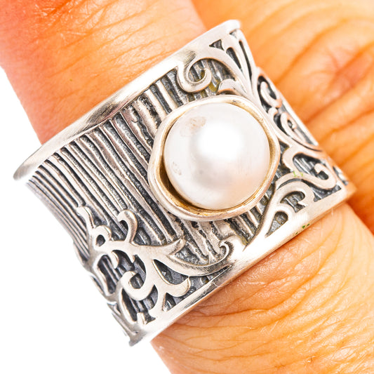 Sterling silver cultured pearl ring with ornate engraved band and round pearl bezel