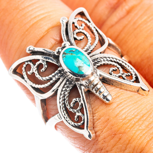 Sterling silver butterfly ring with turquoise oval stone and ornate filigree setting