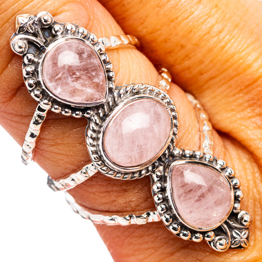 Sterling silver morganite ring with three oval pink stones on an ornate open band
