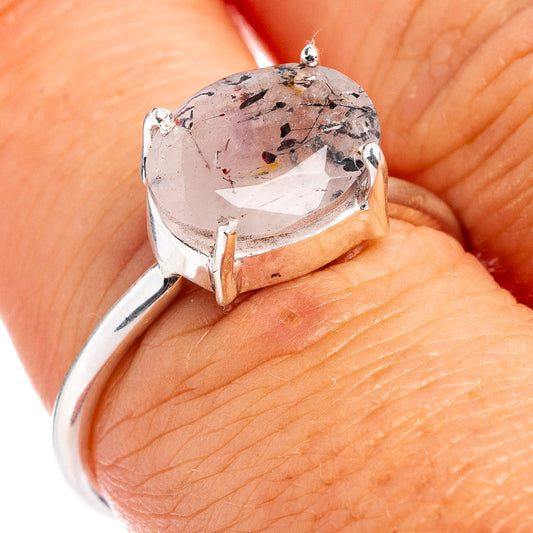 Sterling silver ring with speckled oval gemstone in prong-set bezel and curved band