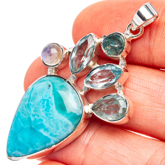 Sterling silver gemstone pendant with large turquoise teardrop and oval blue stones