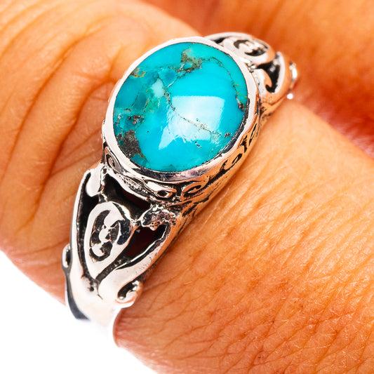 Turquoise oval stone sterling silver ring with ornate cutout band design