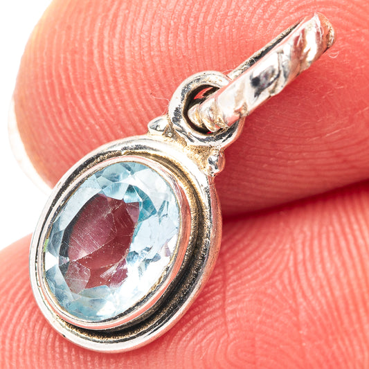 Oval blue topaz pendant in .925 sterling silver bezel, close-up