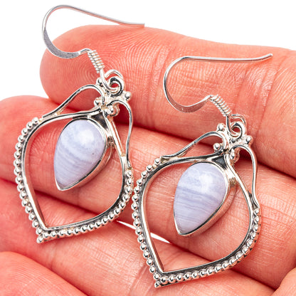 Sterling silver blue lace agate earrings with teardrop stones and beaded heart-shaped settings