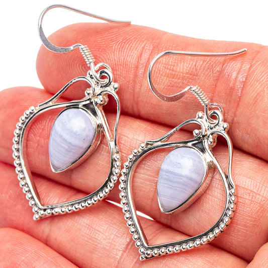 Sterling silver blue lace agate earrings with teardrop stones and beaded heart-shaped settings