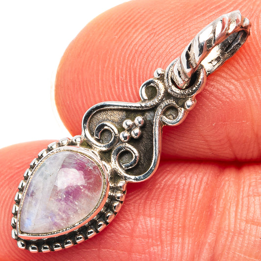 Sterling silver oval moonstone pendant with ornate scrollwork and beaded bezel