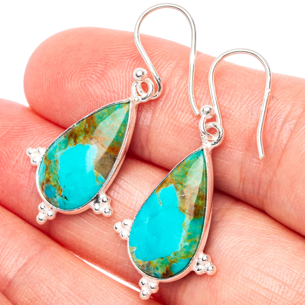 Sterling silver turquoise teardrop dangle earrings with hook backs, ornate bead setting