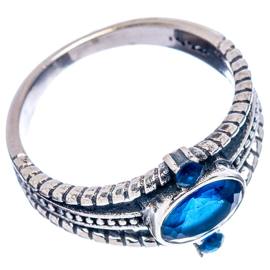 Sterling silver ring with oval blue gemstone bezel and textured band, small blue stones