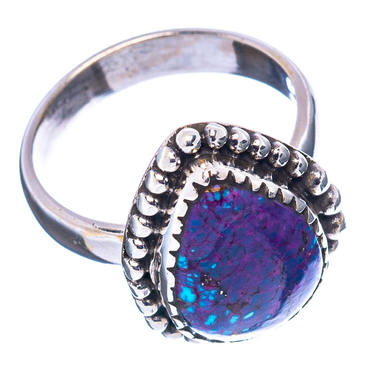 Sterling silver ring showing purple-blue oval cabochon in a beaded bezel