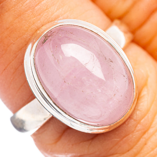 Rose-pink oval gemstone ring with sterling silver bezel setting, close-up view
