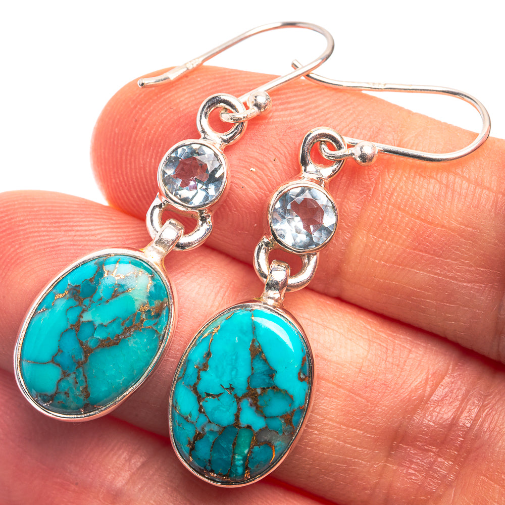 Turquoise oval drop earrings with blue round stones and sterling silver link setting