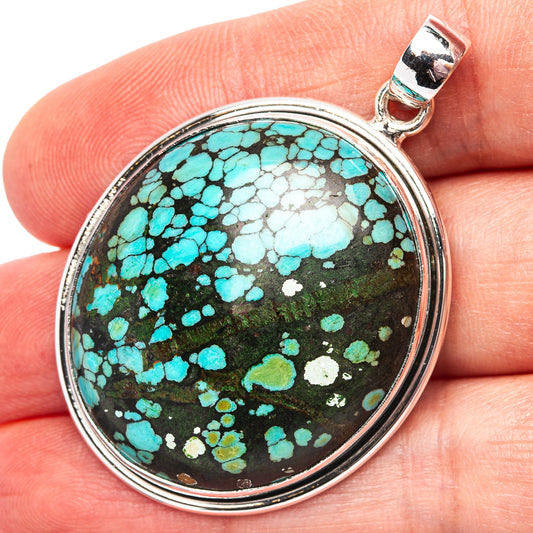 Round turquoise stone pendant in .925 sterling silver bezel, bail loop