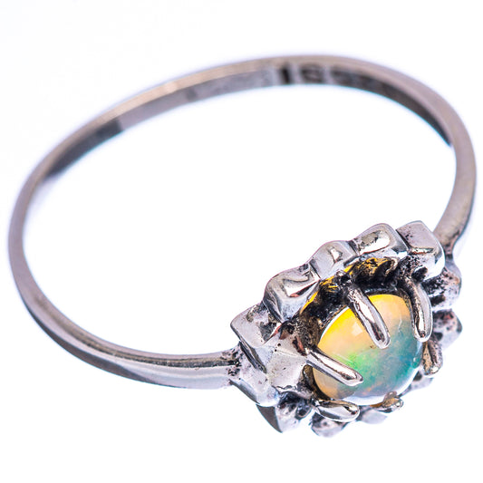 Sterling silver opal ring with oval iridescent opal, side view of prong setting