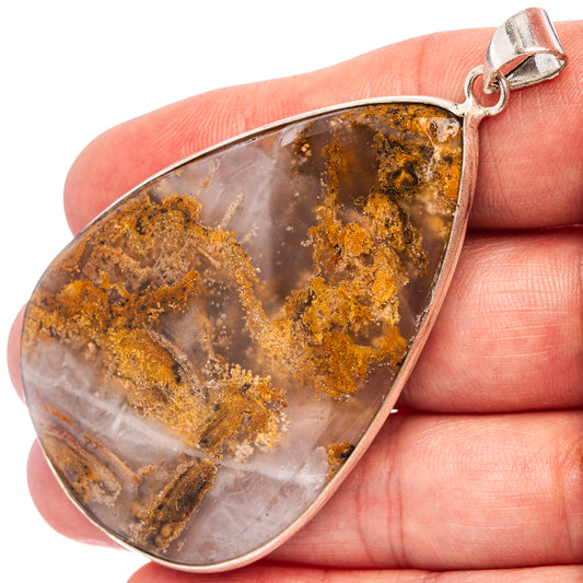 Silver-plated agate teardrop pendant with amber-brown druzy banding and silver loop