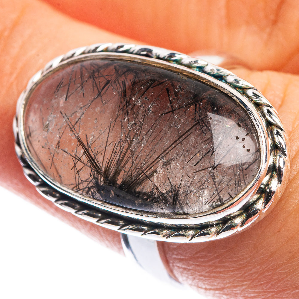 Silver ring with oval tourmalinated quartz cabochon and ornate twisted bezel