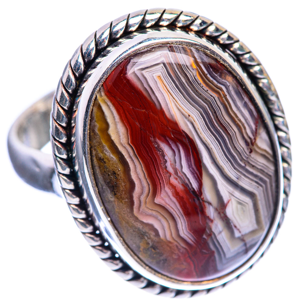 Oval crazy lace agate ring, angled view, red and gray striped stone in twisted silver setting