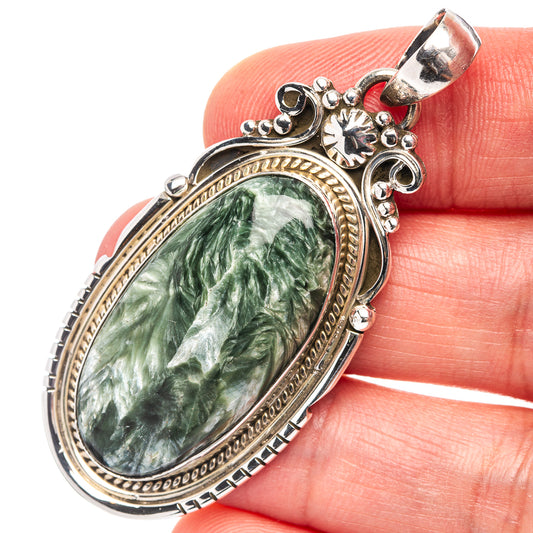 Seraphinite pendant in oval green stone set in ornate .925 sterling silver bezel.