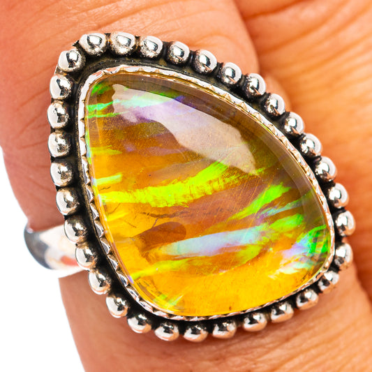 Sterling silver opal ring with teardrop yellow-green iridescent stone