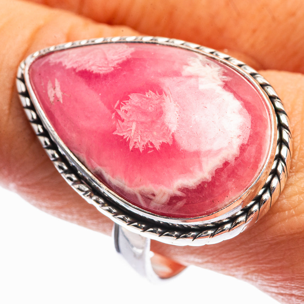 Pink rhodochrosite oval face in sterling silver ring with rope-edged bezel