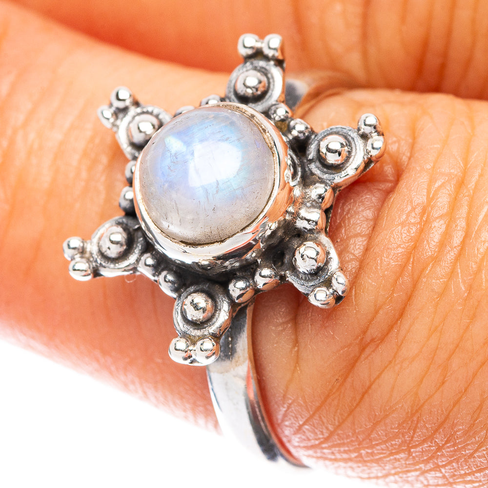 Sterling silver flower ring with oval rainbow moonstone and raised beaded petals
