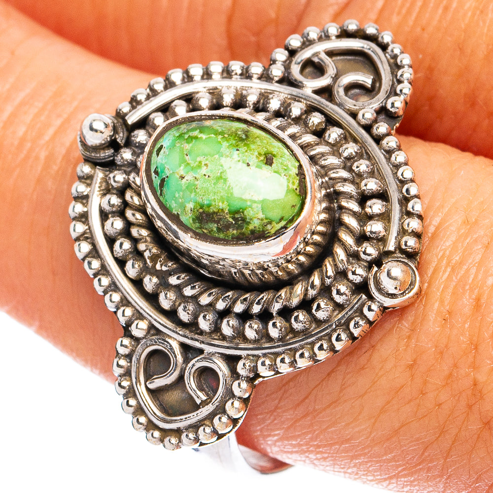 Sterling silver turquoise ring with oval green stone, ornate beaded setting