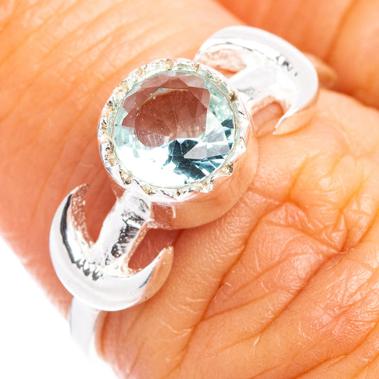 Sterling silver dainty ring with oval blue topaz centerpiece, split shank