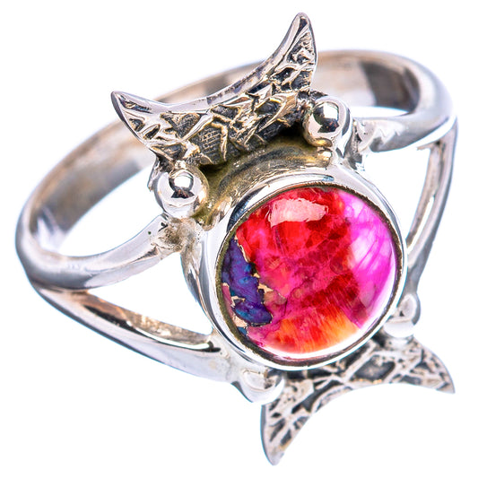 Sterling silver ring with oval red-pink cabochon and star-shaped setting, side view