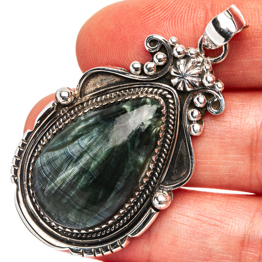 Oval seraphinite pendant with ornate .925 sterling silver bezel and loop bail