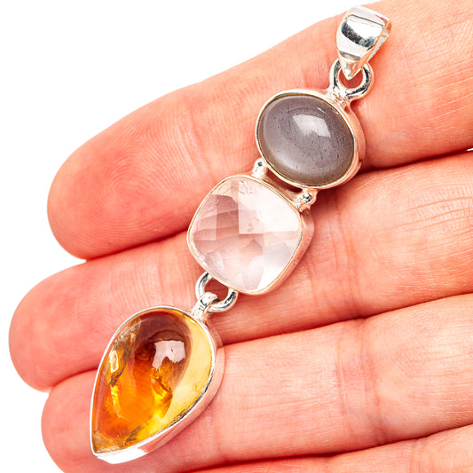 Sterling silver pendant with three teardrop stones: gray, rose quartz, and citrine.