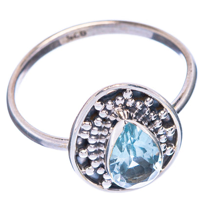 Sterling silver ring featuring an oval blue topaz center stone with beaded border