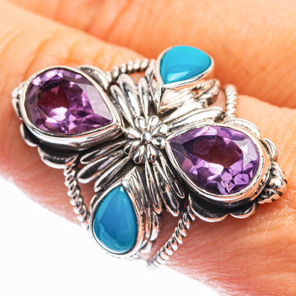 Sterling silver ring with oval amethyst centerpiece, blue turquoise side stones