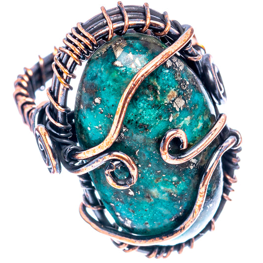 Turquoise oval cabochon ring in oxidized copper with decorative wire spirals and dark band