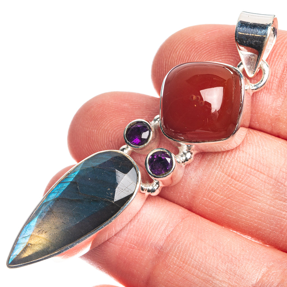 Sterling silver pendant with red square cabochon, purple round stones, and blue teardrop stone
