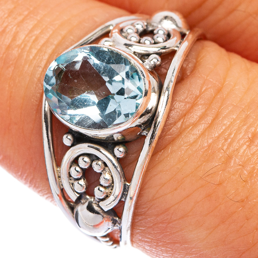 Oval light-blue gemstone set in sterling silver dainty ring with decorative bezels