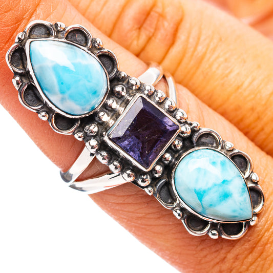 Sterling silver ring with oval blue Larimar, dark purple square Iolite, beaded sides.