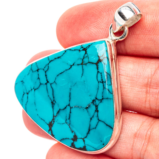 Turquoise teardrop pendant with .925 sterling silver frame and bail