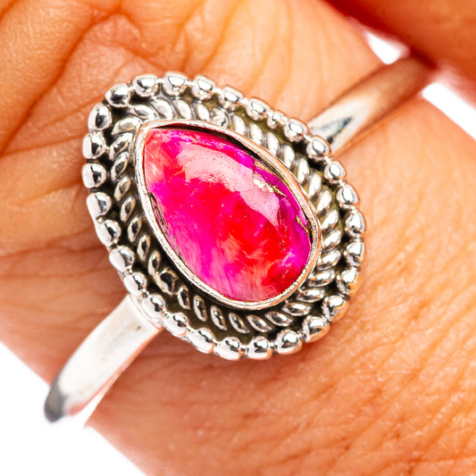 Sterling silver ring with large pink oval gemstone in ornate bead border