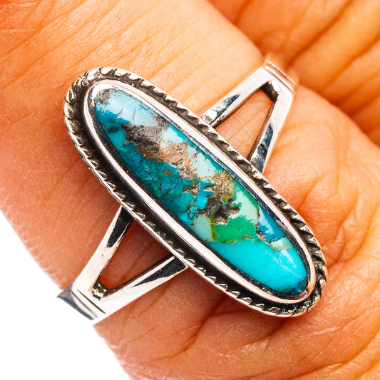 Turquoise oval cabochon sterling silver ring with ornate bezel detail