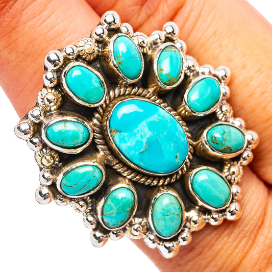 Sterling silver ring with turquoise oval cabochon cluster and ornate settings