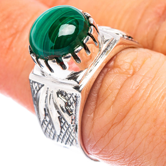 Sterling silver ring with malachite-green cabochon and ornate filigree band